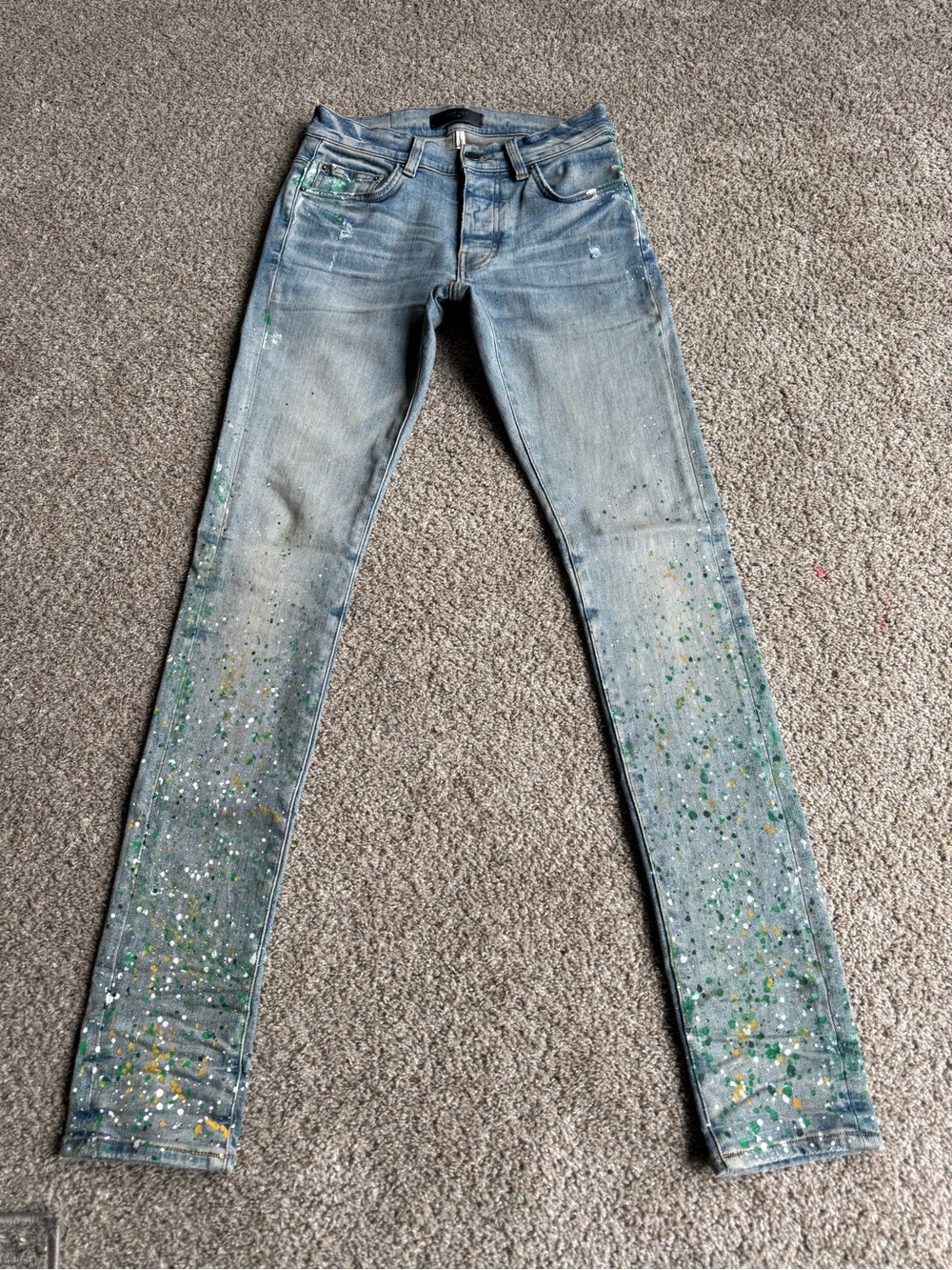 AMIRI Light Wash Skinny Jeans with Green & White Paint Splatter